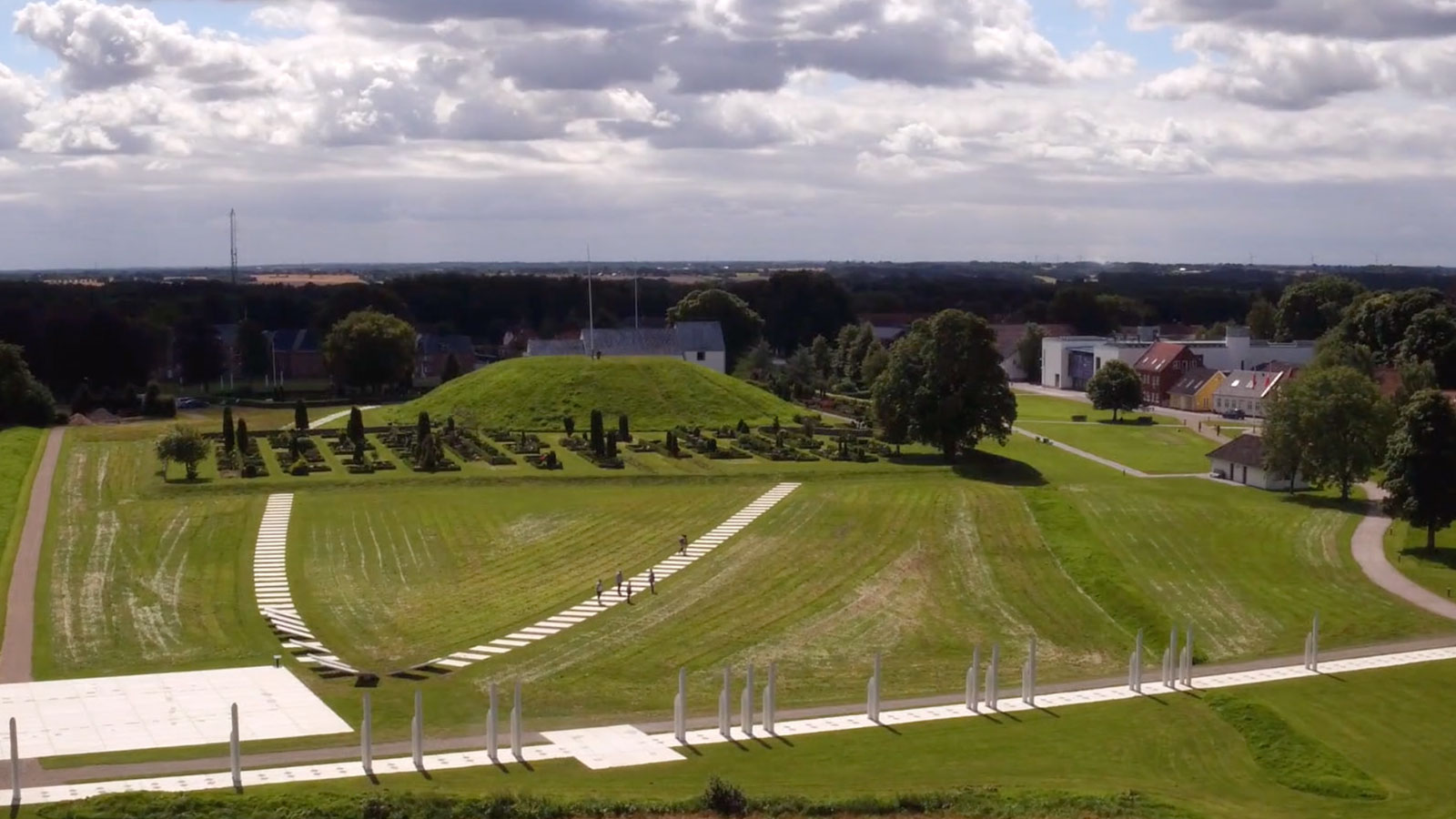 Aerial view of the white marking of the palisade at Kongernes Jelling and the oval castle.